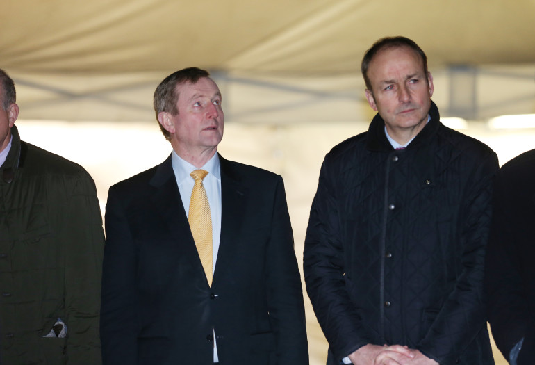 08/12/2015. Ceann Comhairle switch on Oireachtas Christmas Tree lights. Ceann Comhairle turn on the Oireachtas Christmas Tree lights tonight. Fianna Fail leader Micheal Martin with Taoiseach and Fine Gael leader Enda Kenny(L). Music and song will be provided by children from the Holy Family Primary School in Derry, and by the Oireachtas Choir tonight in Leinster Lawn, Leinster House. Photo: RollingNews.ie
