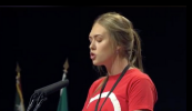 ‘For our community, being invisible is no longer an option’ – cás na Gaeilge curtha i láthair Ard-Fheis Shinn Féin ag mac léinn óg