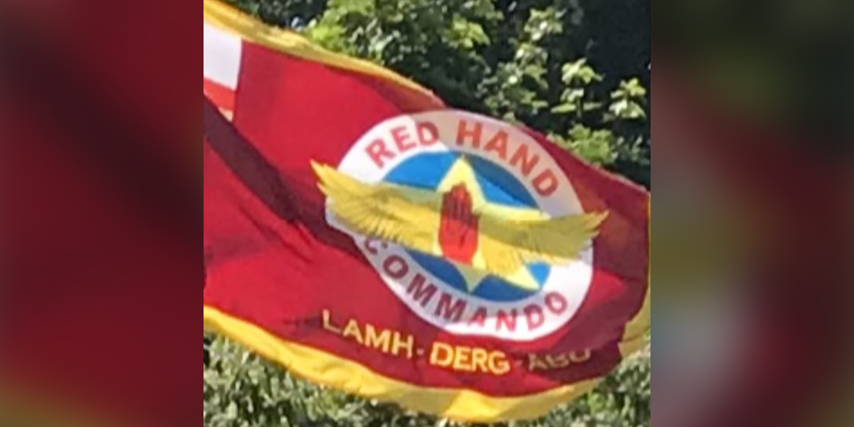 ‘So no Irish Language Act, but Irish Language on a Red Hand Commando flag’ – míshuaimhneas faoi bhratacha paraimíleatacha