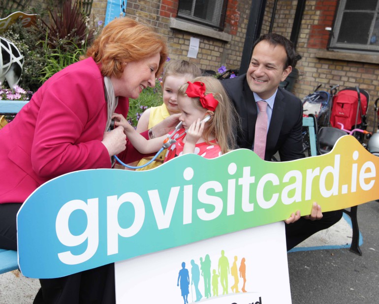 15/06/2015 Free GP care for the under 6. Four-year-old Kiya O'Connor (red) and three-year-old Isabelle Heaps check-up Minister for Health, Leo Varadkar TD and Minister of State at the Department of Health with special responsibility for Primary Care, Social Care (Disabilities and Older People) and Mental Health, Kathleen Lynch TD, at the launch the online registration system for the new Free GP Care for Children Under 6 outside the creche at St. Andrew's Resource Centre, Pearse Street, Dublin. Photograph: Mark Stedman/Photocall Ireland