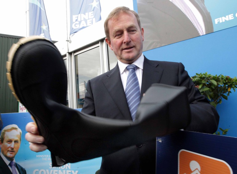 23/9/2015 Taoiseach Enda Kenny TD is pictured checking his wellies getting ready for the Portwest National Welly Competition in aid of EMBRACE Farm at the National Ploughing Championships 2015 in Ratheniska, Co Laois. Photo: RollingNews.ie