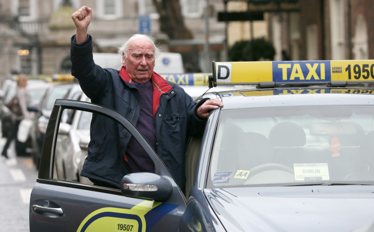 15/01/2014. Taxi protest, Dublin. Taxi Drivers, including Christopher Gorman from Glasnevin in Dublin, bring the city centre to a standstill as they block Molesworth street and streets surrounding the Dail this afternoon to protest against the oversupply of taxis in the city as well as decreased profits. Photo: Laura Hutton/RollingNews.ie