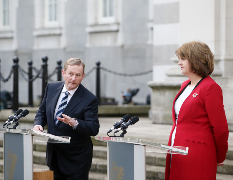 11/01/2016. Programme for Government and the Statement of Government Priorities 2014-2016. Pictured (LtoR) An Taoiseach Enda Kenny TD and the Tanaiste Joan Burton TD reported on progress made in relation to the Agreed Programme for Government and the Statement of Government Priorities 2014- 2016 to the media outside Government Buildings in Dublin this afternoon. Photo: Sam Boal/Rollingnews.ie