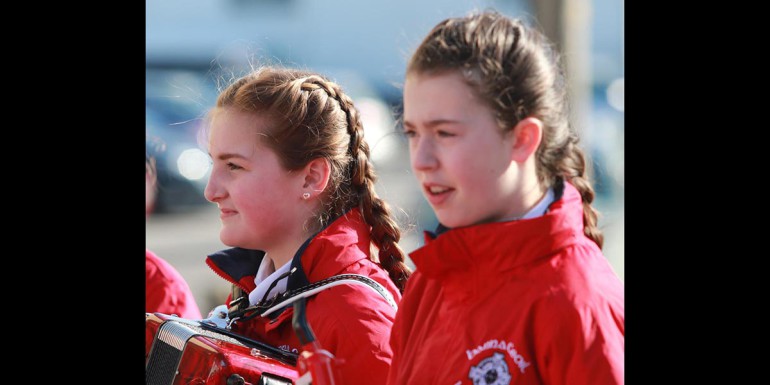 Ciara Greene and Emma Moore with the Loughanure band in Annagry on St Patrick's Day. (Photos: Eoin Mc Garvey)