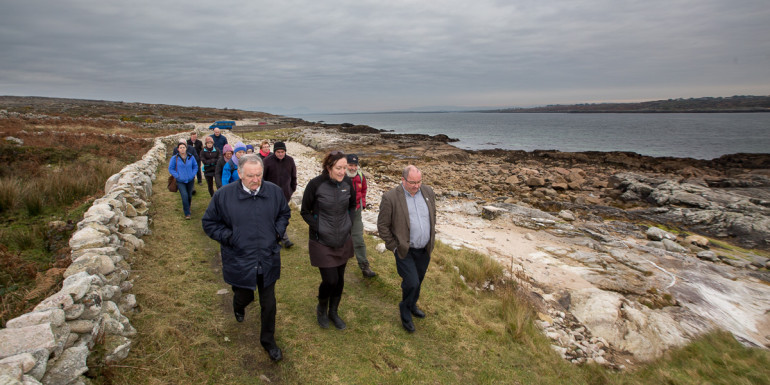 With Greatman's Bay in the background walkers try out the new 8-kilometre coastal loop walk in Garumna, south Connemara. Pictured in front are from left, Terry Keenan, Forum Connemara, Rosaleen Ní Shúilleabháin, (Rural Recreation Officer, Forum Connemara and Senator Trevor Ó Clochartaigh who launched the walk. Pic: Seán Ó Mainnín