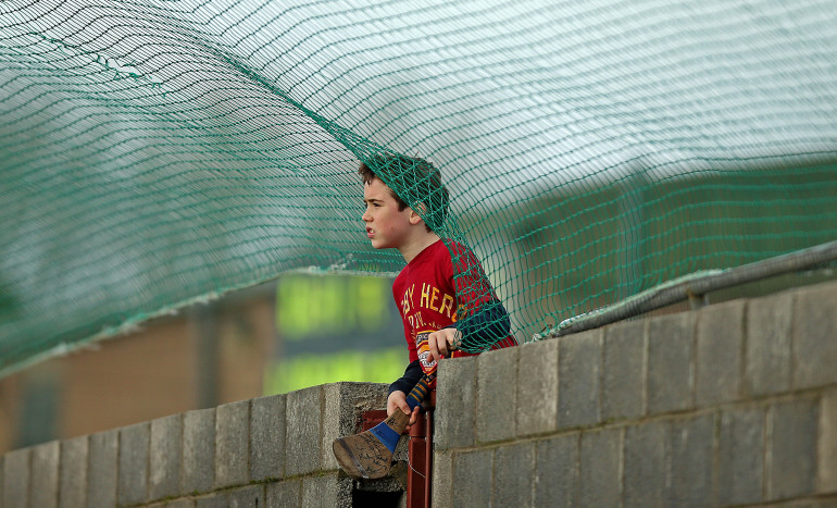 Tipperary Senior Football Championship Final, Cashel, Co. Tipperary 21/12/2014 Cahir vs Loughmore Castleiney  A young supporter looks on from behind the goal Mandatory Credit ©INPHO/Donall Farmer