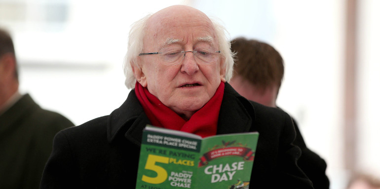 2014 Leopardstown Christmas Festival, Leopardstown Racecourse, Dublin 27/12/2014 President Michael D Higgins checks his race card in The Winning Line tent at Leopardstown ahead of the day's racing Mandatory Credit ©INPHO/Donall Farmer