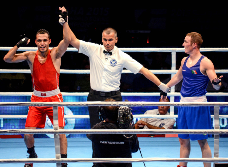 2015 AIBA World Boxing Championships, Doha, Qatar 14/10/2015 Middleweight Olympic Box-Off Michael O'Reilly vs Hosam Abdin Ireland's Michael O'Reilly (Blue) with Hosam Abdin (Red) of Egypt as he is declared the winner Mandatory Credit ©INPHO/Francis Myers