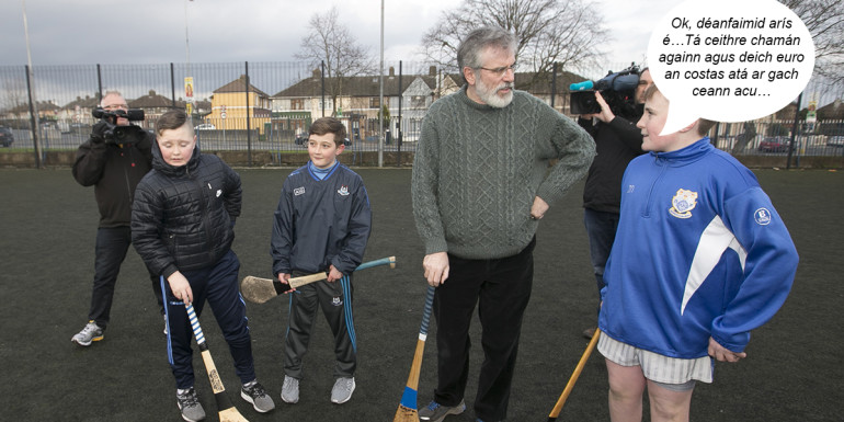 13/02/2016. Sinn Fein Canvassing. Pictured Sinn Fein President Gerry Adams TD stops at Naomh Fionnbarra GAA Club in Cabra in Dublin this afternoon to play hurling with (LtoR) Calvin kearney (12), Kian ryan (12) Jack Naughton (13) whilst canvassing in the area with Deputy Leader and candidate in Dublin Central. Photo: Sam Boal/Rollingnews.ie
